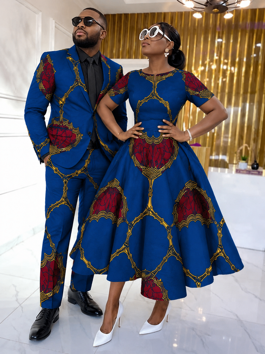 Couple styled in royal blue and crimson Ankara — man in tailored suit, woman in flare dress