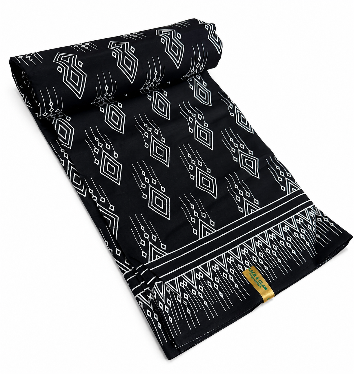 Black and white geometric diamond African wax print cotton fabric rolled on white background showing full width and selvedge border
