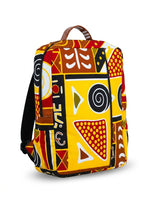 Side view of Ankara mudcloth print backpack showing padded black straps, side zip pocket and full tribal print coverage