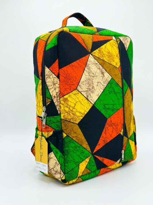 Front angle view of Ankara geometric kaleidoscope patchwork backpack in green, orange, yellow and black triangle print with Ankara top handle
