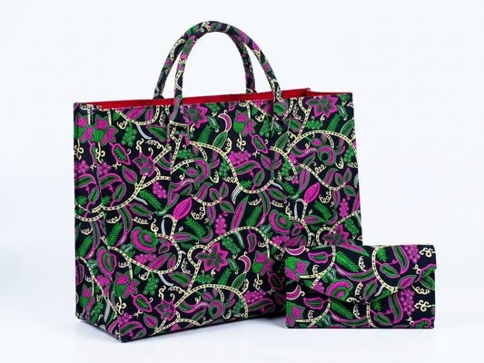 Front view of large Ankara botanical tote bag with matching clutch purse in hot pink, green and cream floral print on black base