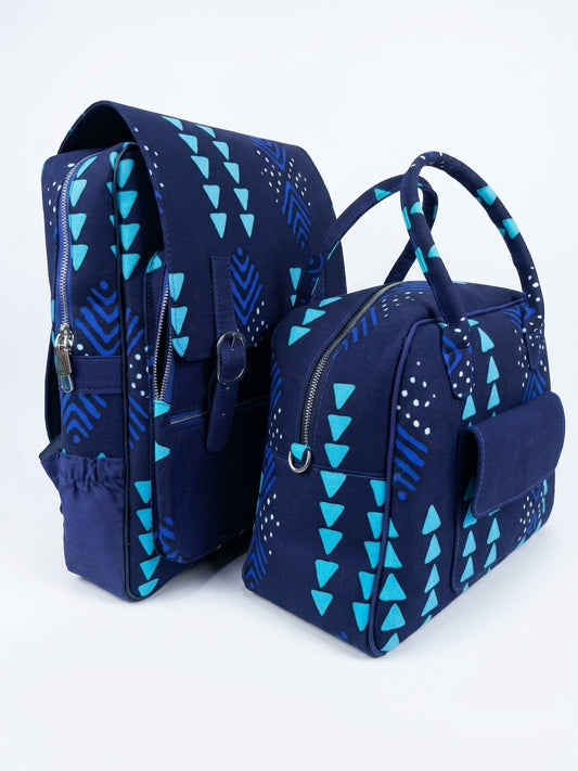 Side view of Ankara navy blue teal triangle print backpack and handbag set showing padded straps, side zip pockets and structured silhouette