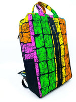 Side view of Ankara print backpack in multicolour mosaic crackle pattern with dual zip compartments and top carry handles