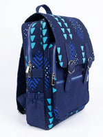 Side view of navy blue Ankara print satchel backpack with teal geometric triangle and chevron print, silver buckle straps and side zip pocket