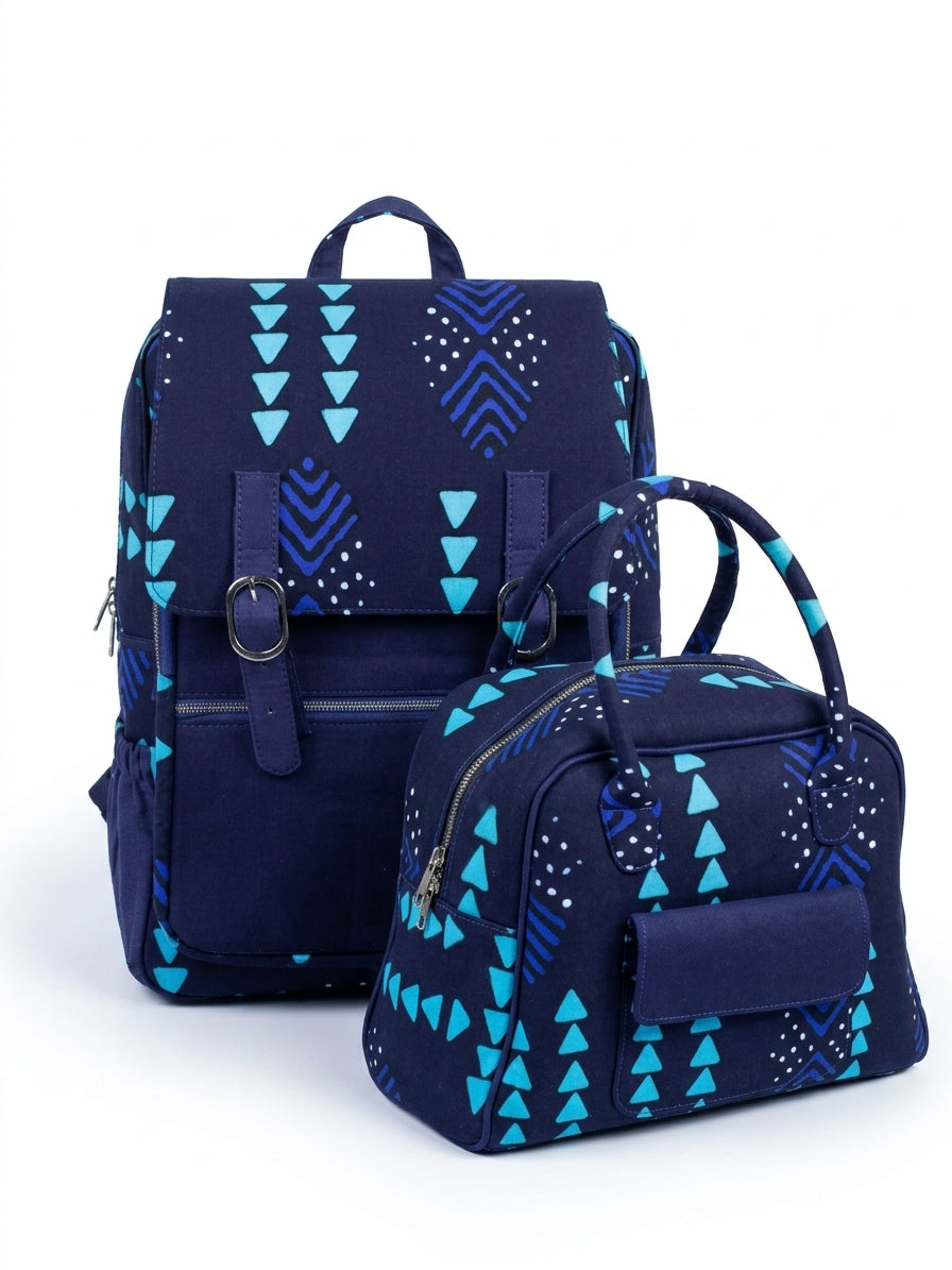 Front view of Ankara navy blue teal triangle print backpack and handbag set showing dual silver buckle closure and zip pockets