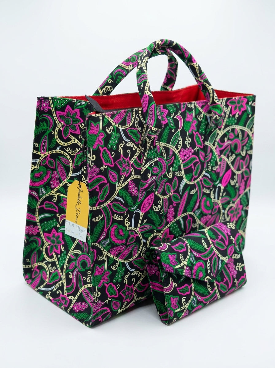 Ankara floral tote bag and clutch set in hot pink and green botanical print on black base, with Ankara-wrapped rope handles and red lining, House of Prints tag visible