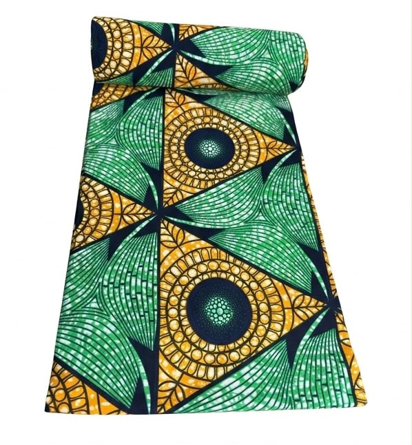 Green and gold geometric fan Ankara wax print fabric unrolled showing full pattern detail