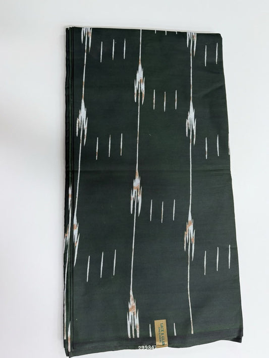 Emerald green ikat streak African wax print cotton fabric folded flat on white background showing full print detail and selvedge label