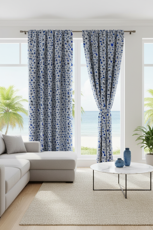 Curtains and window drapes made from white and blue polycotton Ankara fabric