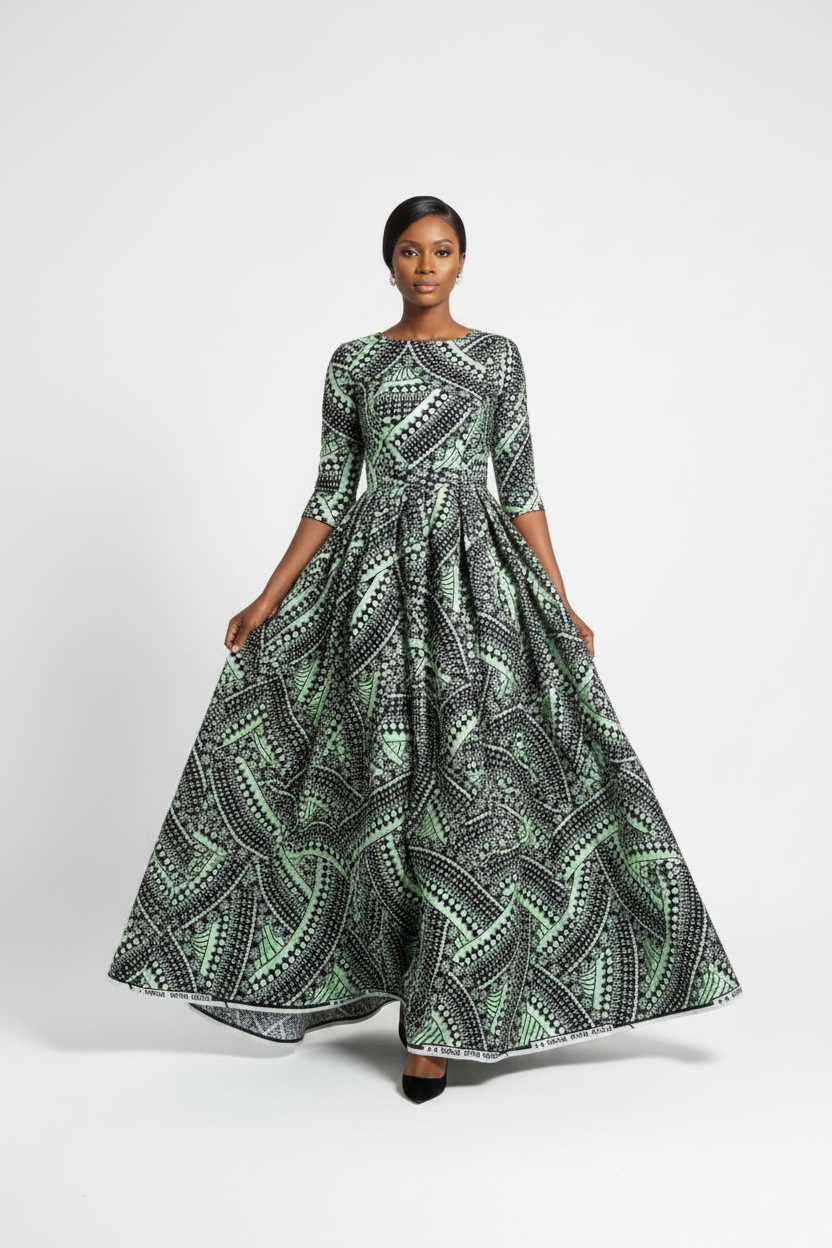Woman walking gracefully in black and mint Vlisco Grand Super Wax Ankara maxi dress on white background