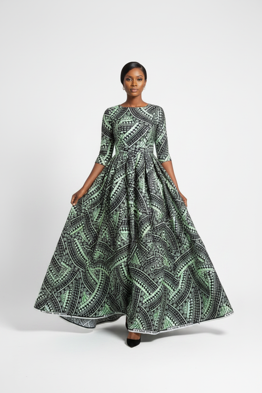 Woman walking gracefully in black and mint Vlisco Grand Super Wax Ankara maxi dress on white background