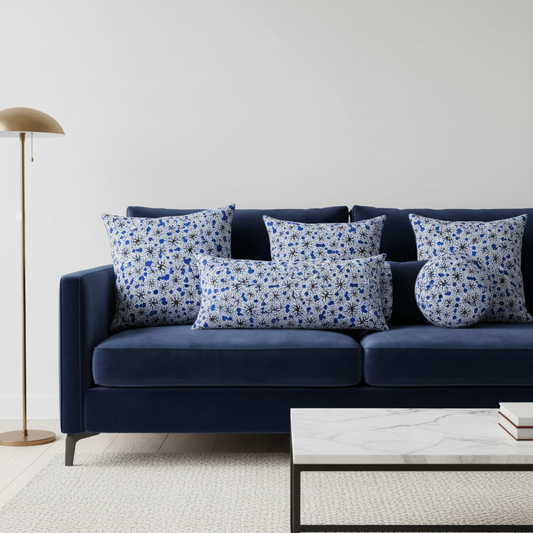 Decorative throw pillows made from white and blue polycotton Ankara fabric