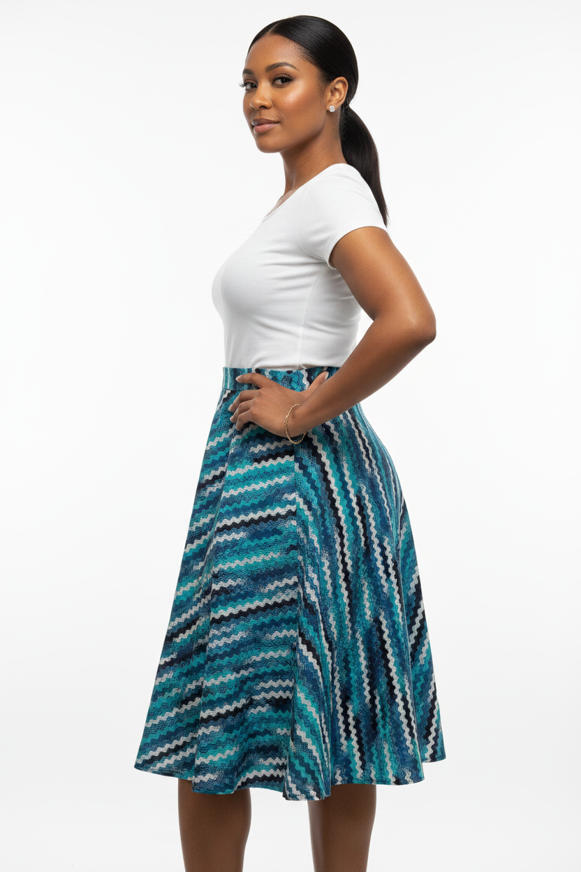 Mixed race model in dynamic pose wearing teal zigzag African print skirt
