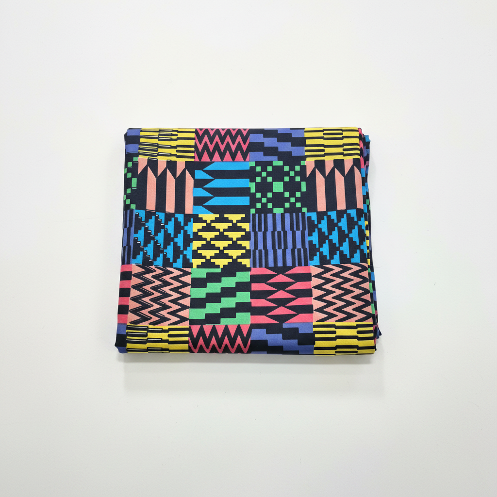 100% cotton Ankara Kente fabric flat lay — bold geometric multicolour print, studio product shot on white background